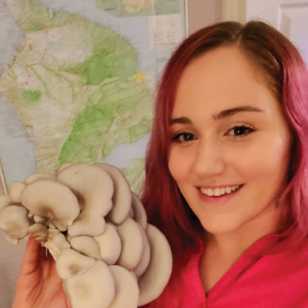 Amanda Gilroy poses with a musrhoom