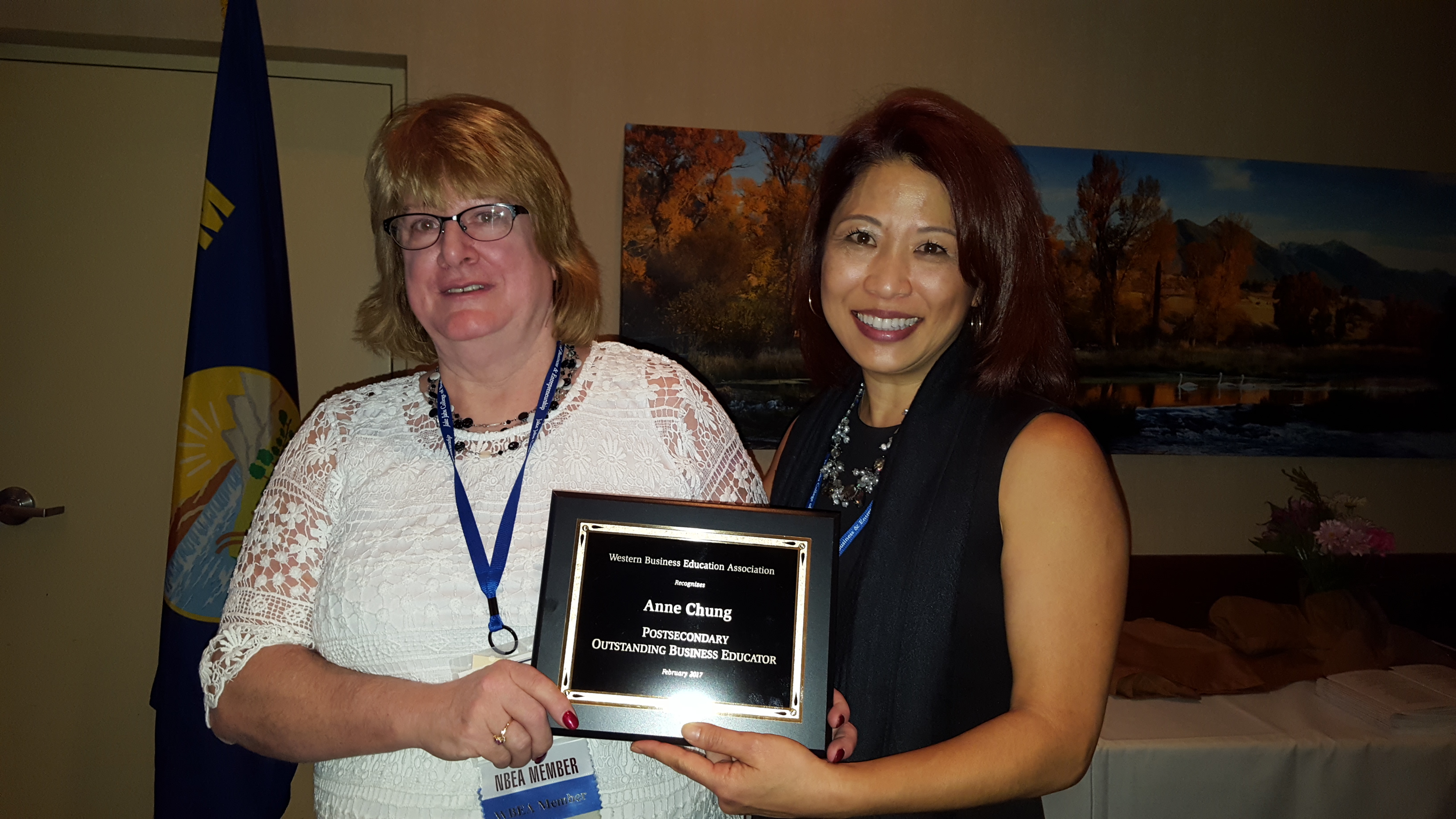 Anne Chung, right, receiving her award at the WBEA conference in Bozeman. Presenting the award is Elaine Stedman, WBEA President.