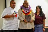 Allen Bartolome, center, receives the Dr. Julius Soria Award. 