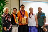 Jason Dela Cruz, center, receives the Tagumpay Award. 