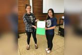 Students holding certificate