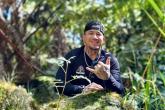 Drew Camacho working on restoring ancient Hawaiian trails in the Pālamanui Dryland Forest Reserve
